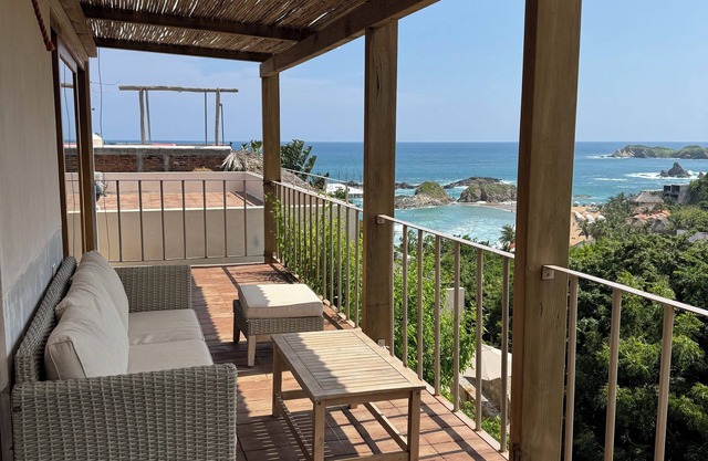 King suite with stunning views of the sunset, beach, and scenic surrounding.