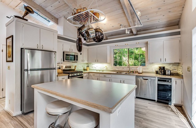 Modern, Dog-Friendly Retreat with a Private Deck, Hot Tub, Fireplace, & Sun Room