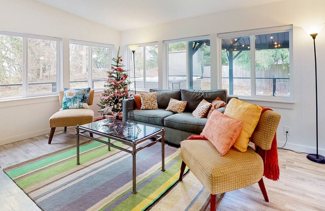 Modern dog-friendly home with private hot tub, fantastic deck, & woodstove