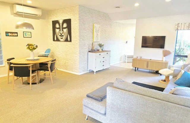 Modern Family Oasis in Clive Spacious fully furnished 3 bdrm home w/ AC.