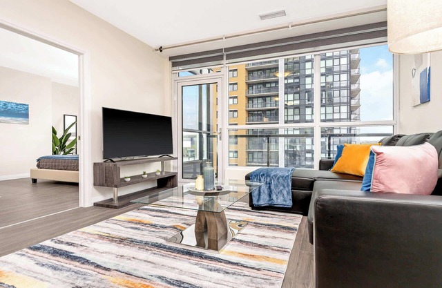 Modern High Rise Condo w Private Patio—Downtown