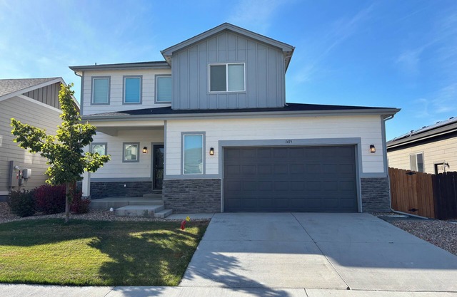 Modern home with a large fenced yard, garage access, and office space