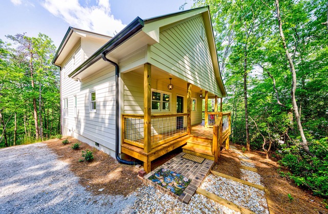Modern mountain-view retreat with private deck, firepit, grill, fireplace, & W/D