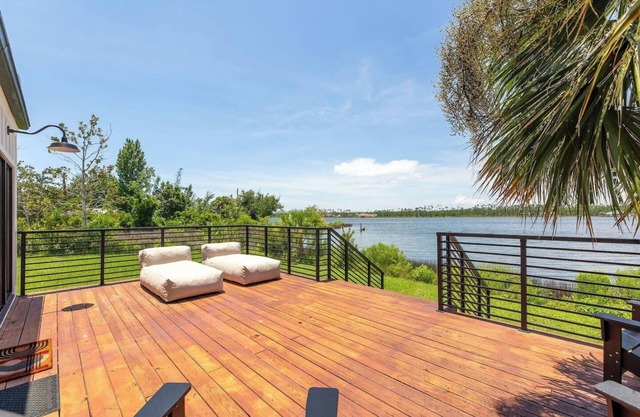 Modern oasis with private pool, dock and water views