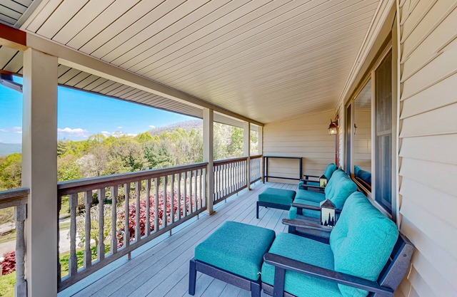 Mountain view home with a furnished deck, gas fireplace, & washer/dryer