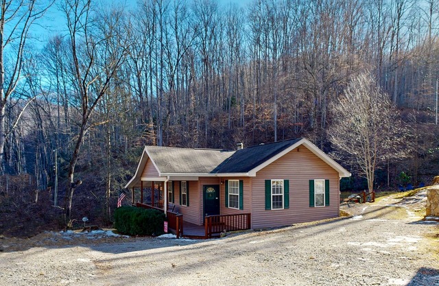 Mountain view home with a fireplace with beautiful view of the creek