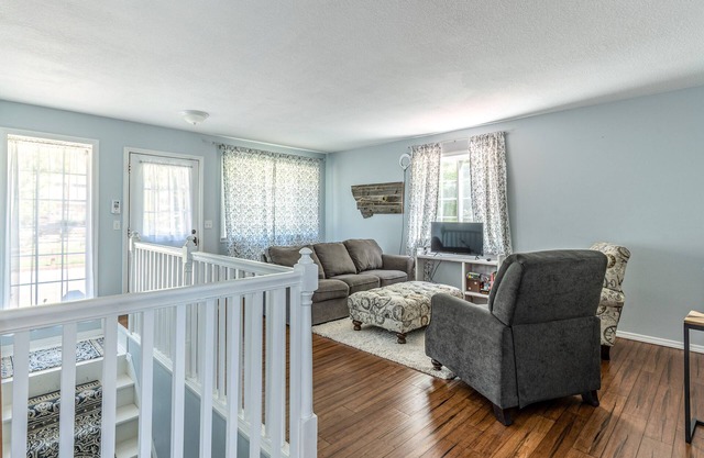 Mountain-view home with large deck, gas grill, firepit, lawn, and central AC