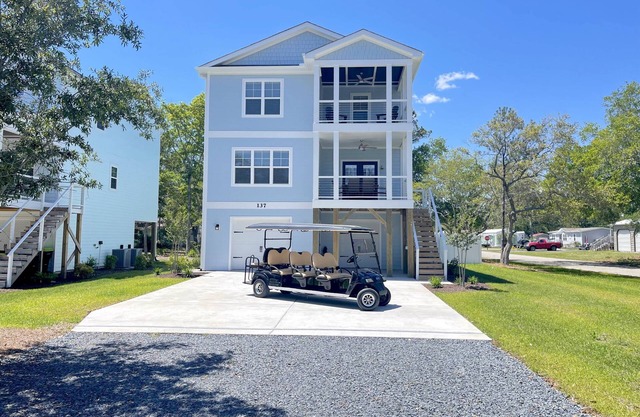 Brand new gorgeous home with Pool, New 8 seater Golf Cart, elevator, with easy access to beach