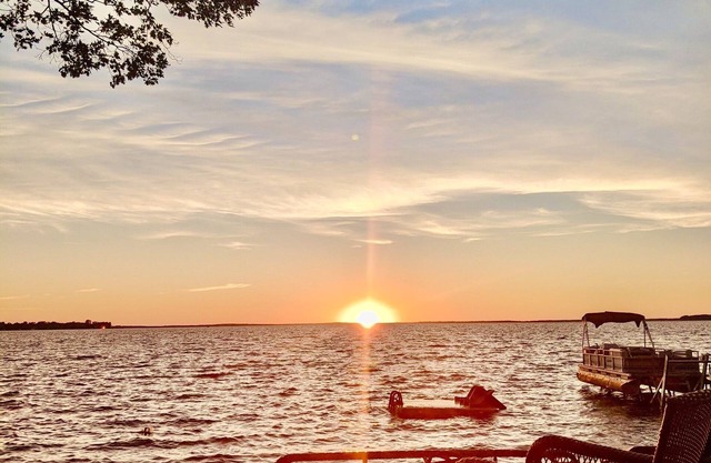 New Listing! Lake front cottage with 100' of private sandy beach