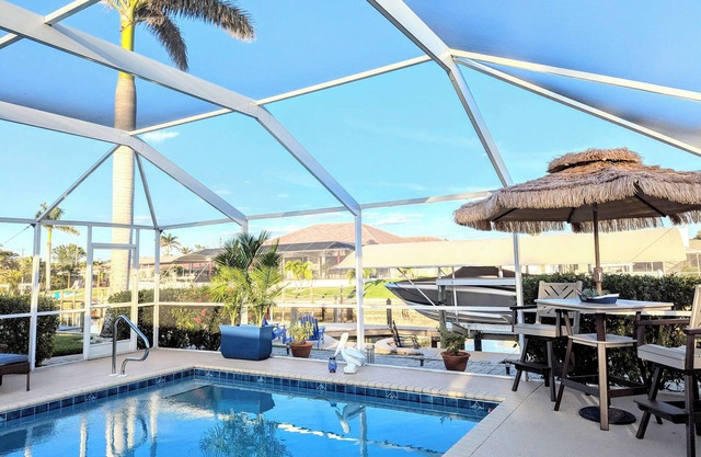 NEW LISTING Waterfront Canal Tropical Oasis Immaculate Home