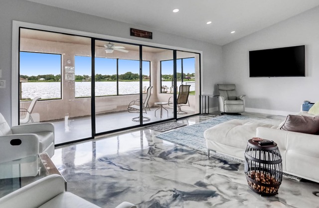 Newly renovated lakefront home with private dock, screened lanai, & W/D