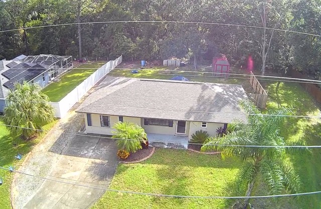 Nice 2/2 house just 3 blocks from The Villages! Serene privacy with forest view!