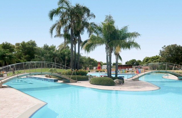 Bel appartement dans une maison de vacances avec climatisation, piscine, terrasse et animaux admis