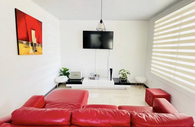 Nice house 15 from the airport great rooftop view in heredia , 24/7 security…..