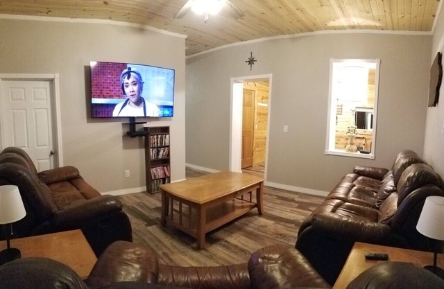 25% off may special! The Depot” 2bed 1 bath home. Outdoor party area with tv