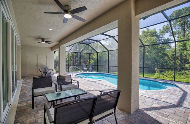 Open Concept home with Heated Pool in peaceful North Port 3 Bdrm, 4 Bath + Den