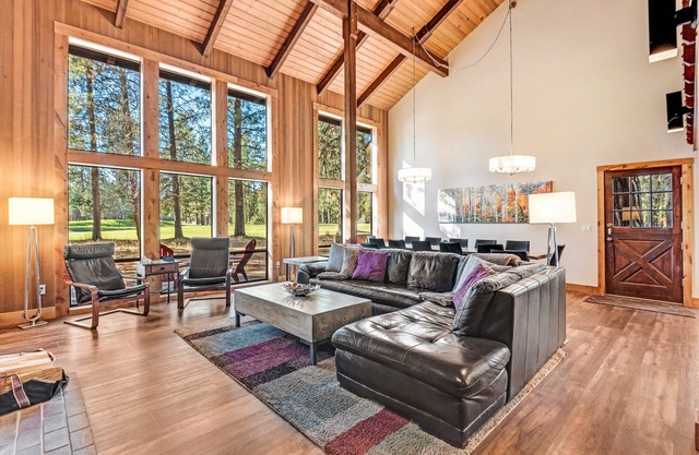 Opulent home with fairway view, fireplaces, huge deck, & hot tub