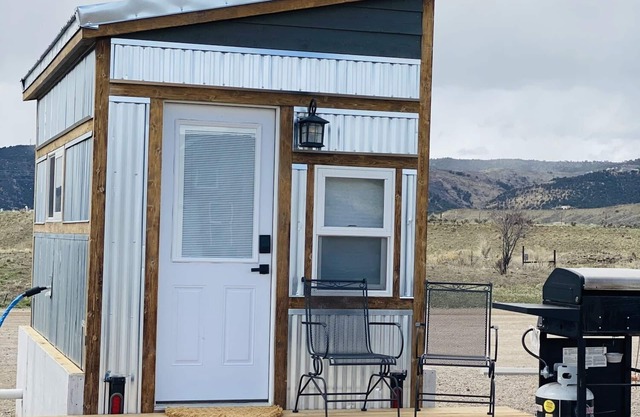 Our tiniest Tiny Home packs a punch! It contains a Queen bed in a loft accessed by a ladder. Sleeps: 2