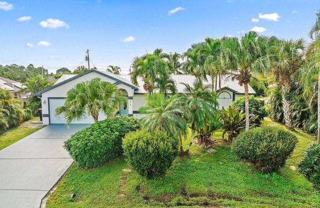 Single Family Home with private pool, outdoor living space, and lanai