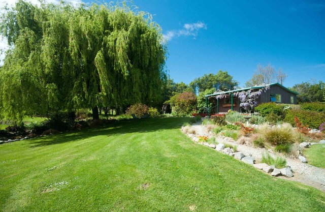 Cottage confortable et paisible dans un jardin magnifiquement paysagé