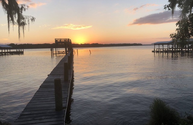 Peaceful Waterfront Home on St. Johns with large porch and dock.