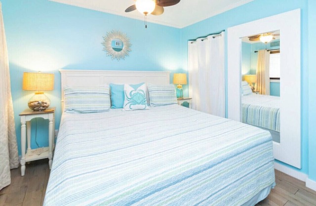 Peek of the ocean King size bed just Steps from the Beach