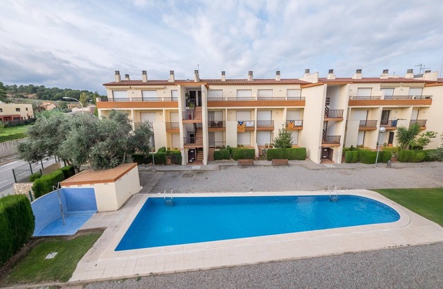 Penthouse à l'Escala avec piscine commune.
