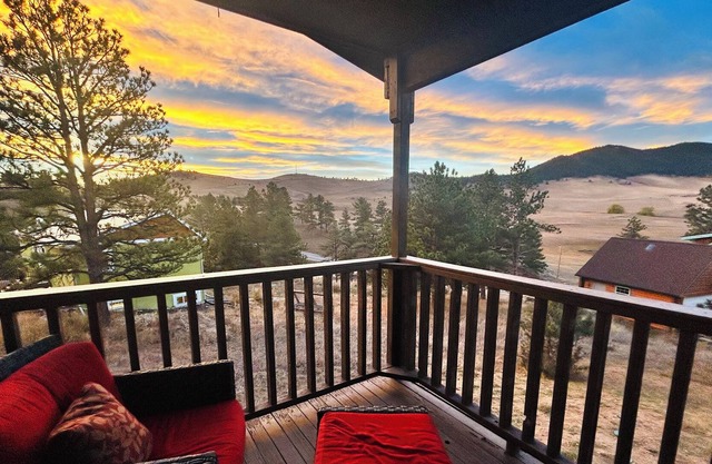 Pinewood Lake Cabin - Deck view and cozy interior.