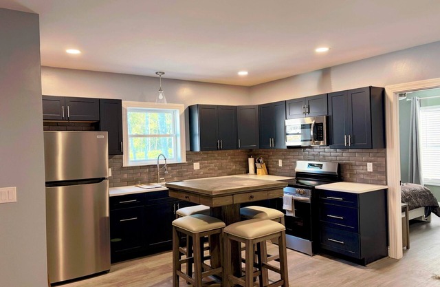 Pristine upscale 2 bedroom duplex unit surrounded by forest.