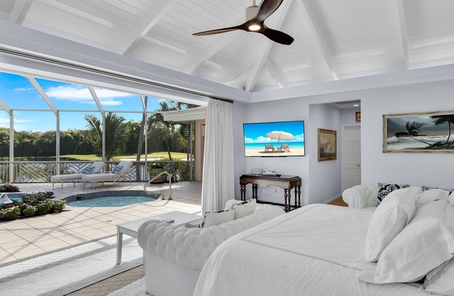 Private 5 BR Ocean Reef Estate overlooking pond and The Hammock Golf Course.