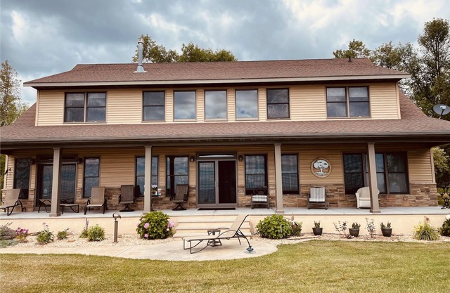Private Lake front home on 1200 feet of sandy beach. All year round house.