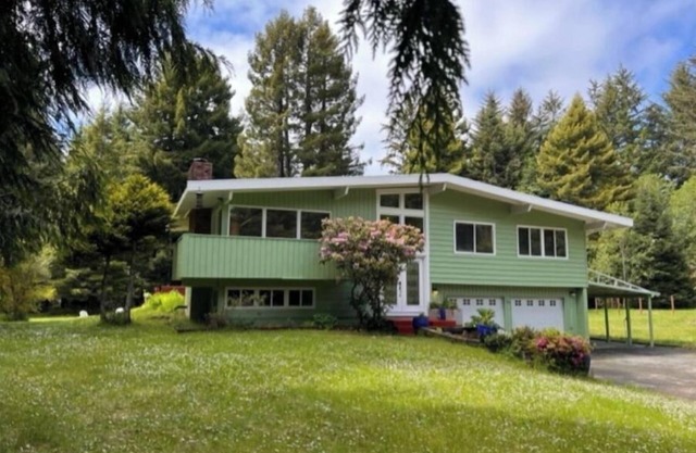 Private mid-century modern hideaway in forest near the river and sea.