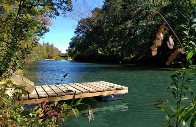 Private River Camping with Kayaks & Outdoor Bathhouse! Pet friendly!
