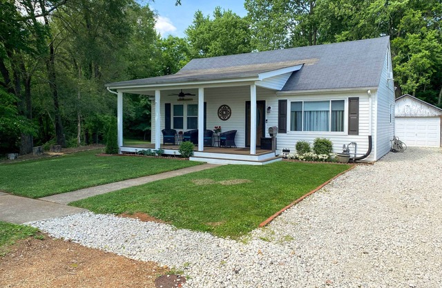 Quaint Creekside Cottage w/ Porch & Backyard!