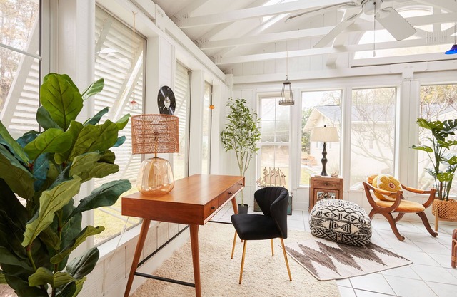 Quiet home with sunroom, modern amenities, fenced in yard, EV Charging, & more!