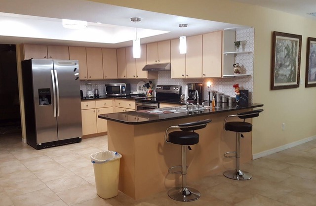 Quiet home with heated pool and privacy fence! Pet friendly!