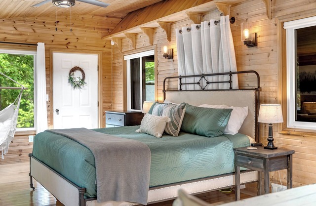 Quiet, private and wooded waterfront on a huge lot. King beds. Boats included!