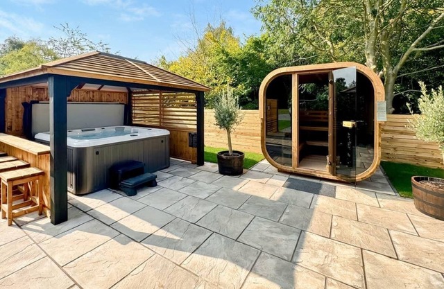 Upgraded for 2024 with Gazebo over hot tub and side bar with stools.