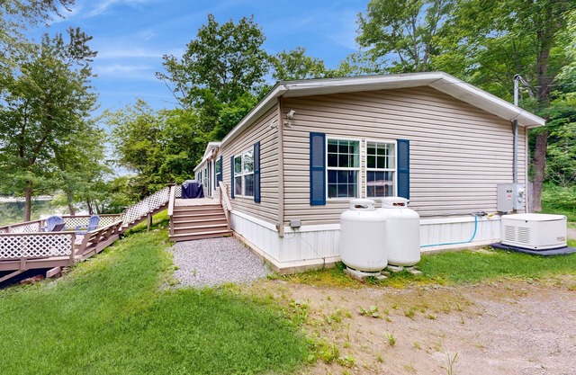 Renovated waterfront home with amazing views, dock, yard games & fireplace