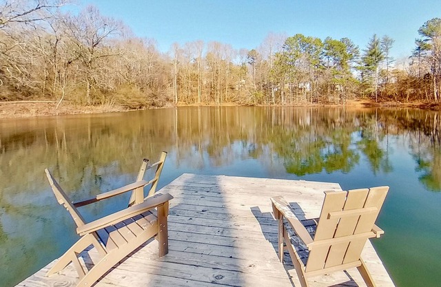 Retreat by the water with a hot tub, washer/dryer, and central air-conditioning