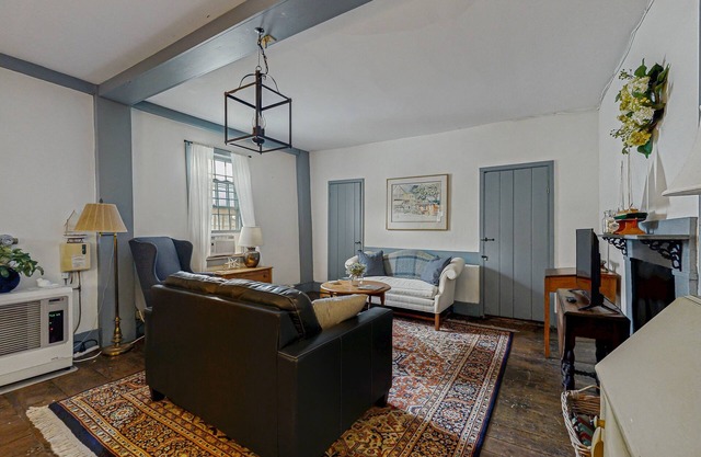 Riverfront condo w/ deck overlooking the water - steps to dining & shopping