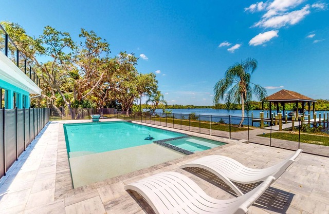 Riverfront home - pool, pool spa, dock, & bikes