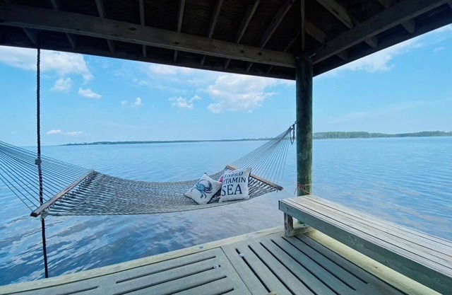 Private intracoastal home with dock and ramp. Dolphins, fish, boat, swim & more