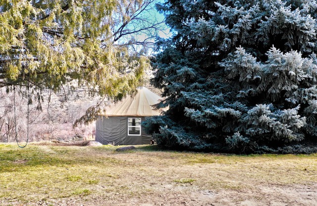 Riverfront Yurt near Hot Springs, Kayaking and Hiking