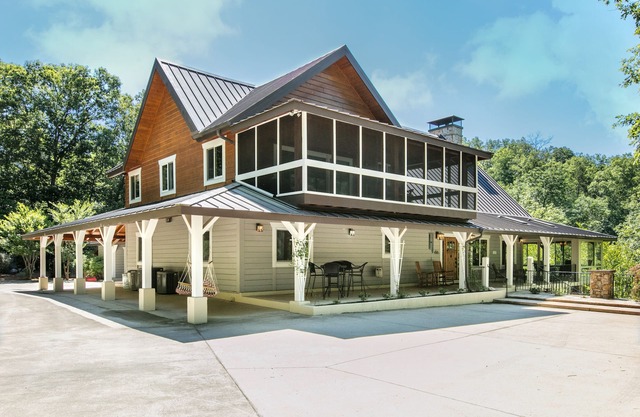 Riverside opulence with game room, private heated pool, hot tub & firepit