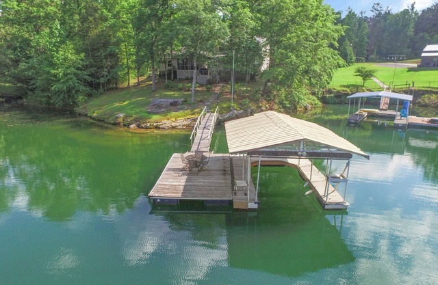 Enjoy the view from screened in porch or lakeside fire pit