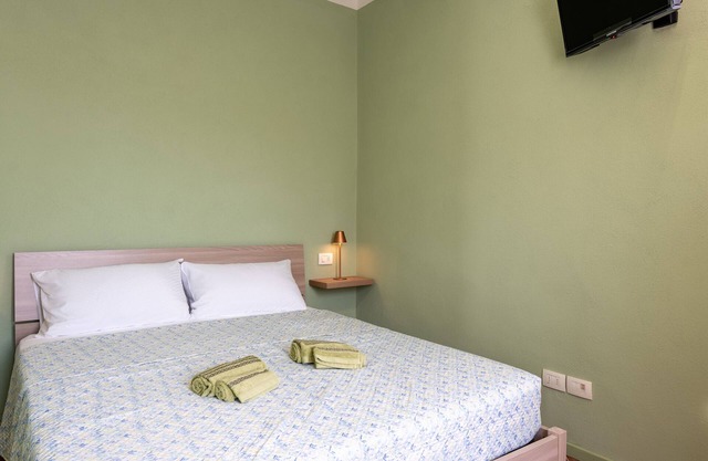 Chambre 'Stanza Verde' avec balcon, Wi-Fi et climatisation
