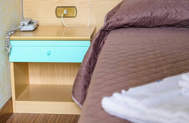 Chambre 'Tripla - Letti Singoli' avec jardin partagé, Wi-Fi et climatisation