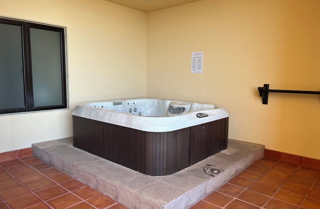 Room with a view of the Pacific and a private Jacuzzi at Sunset Beach Resort