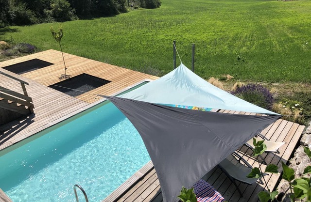 Maison en bois avec piscine privée chauffée, terrasse et jardin - Ideal famille et nature